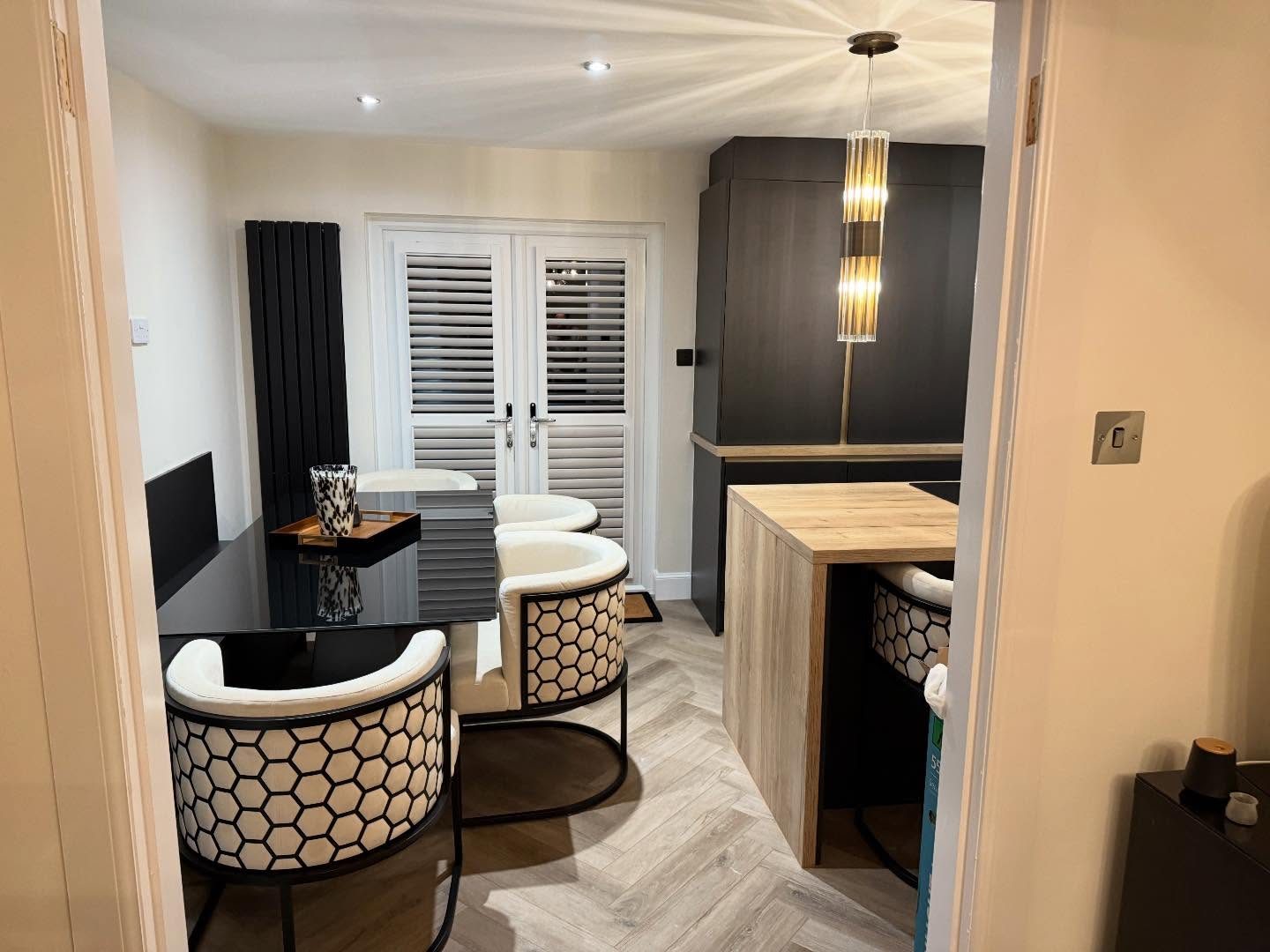 White window shutters in a modern Glasgow bathroom interior